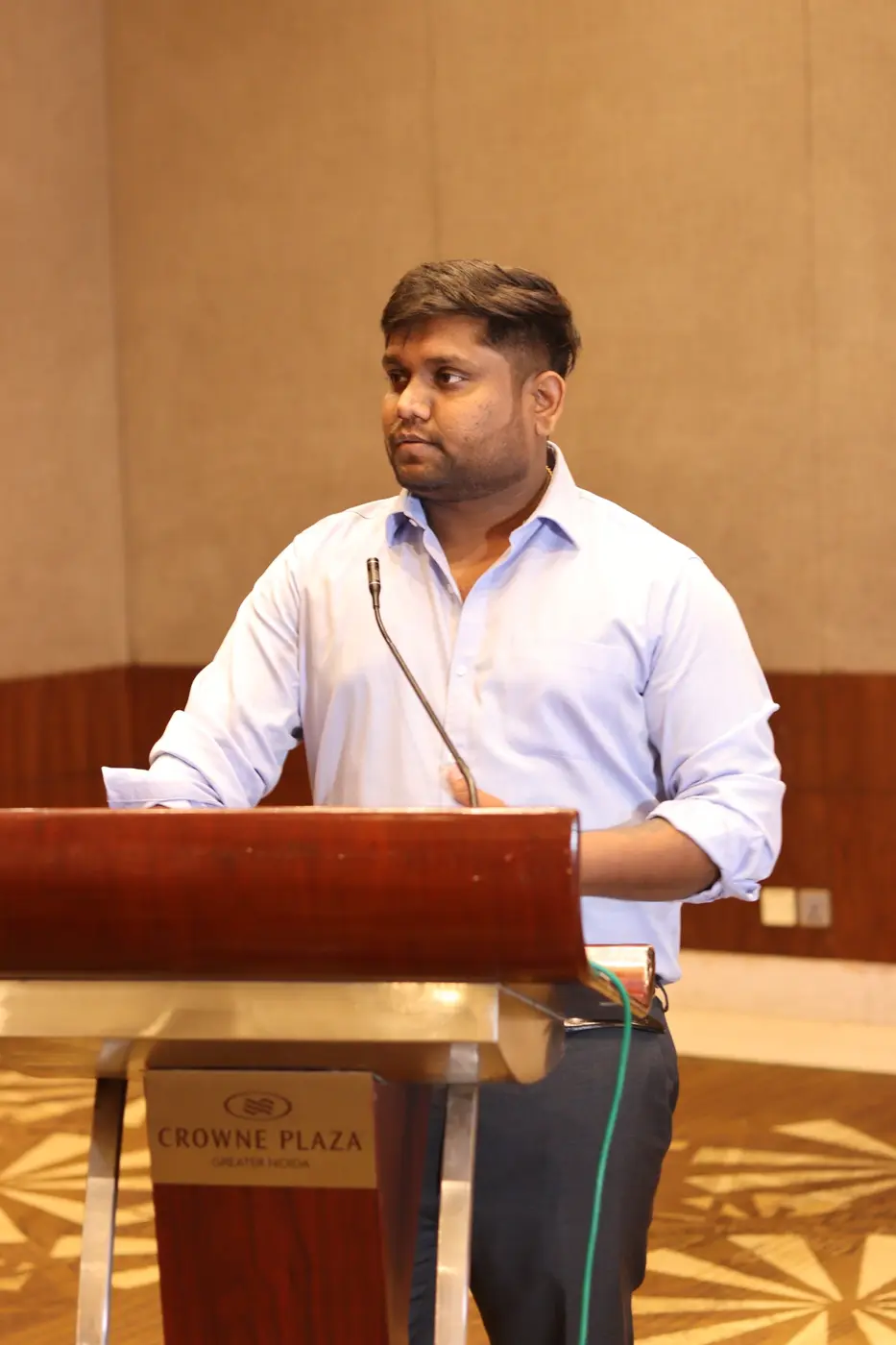 Abhishek Sharma speaking at an event
